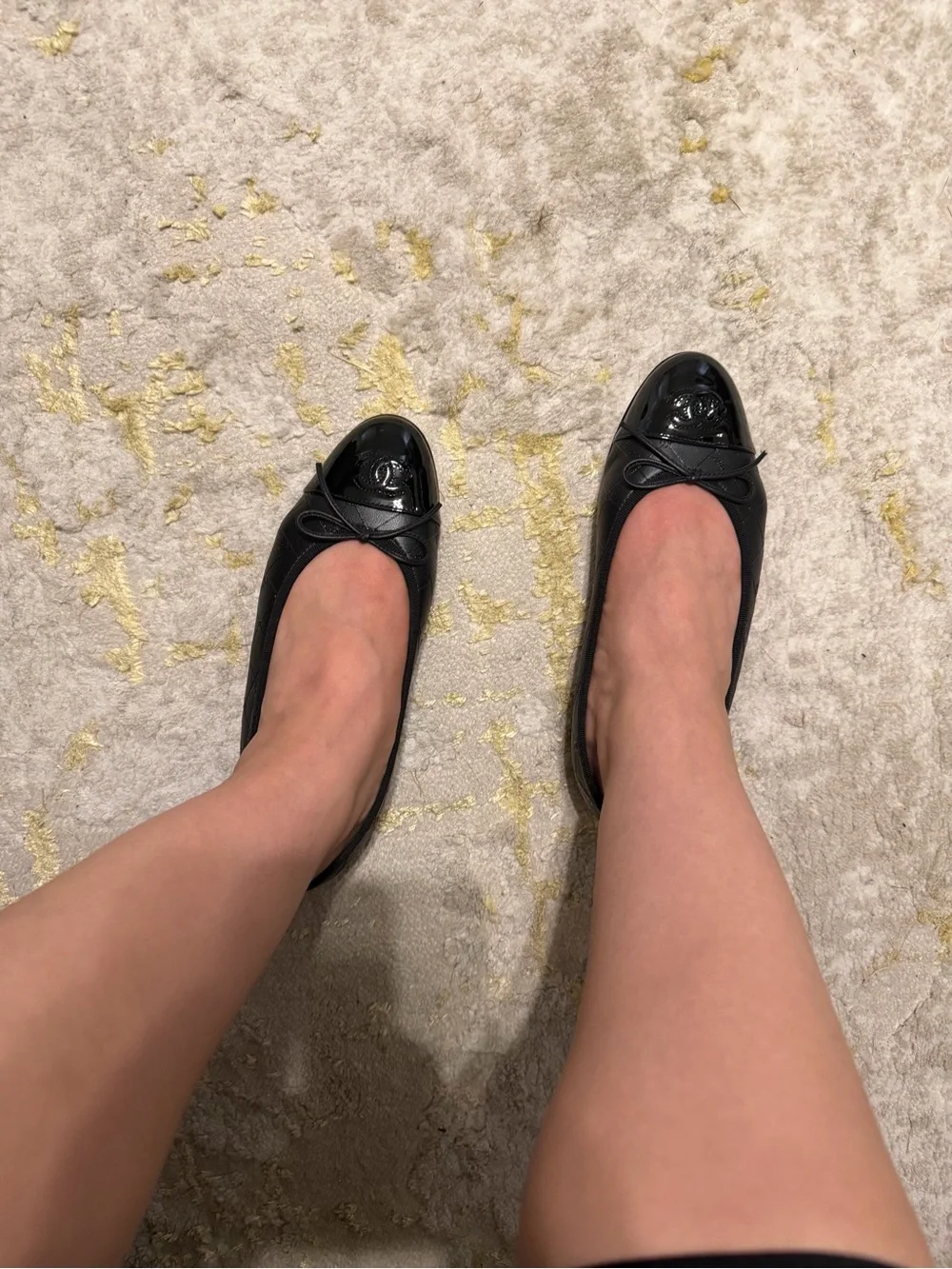 CHANEL Black Quilted Leather Cap-Toe Bow Ballet Flats